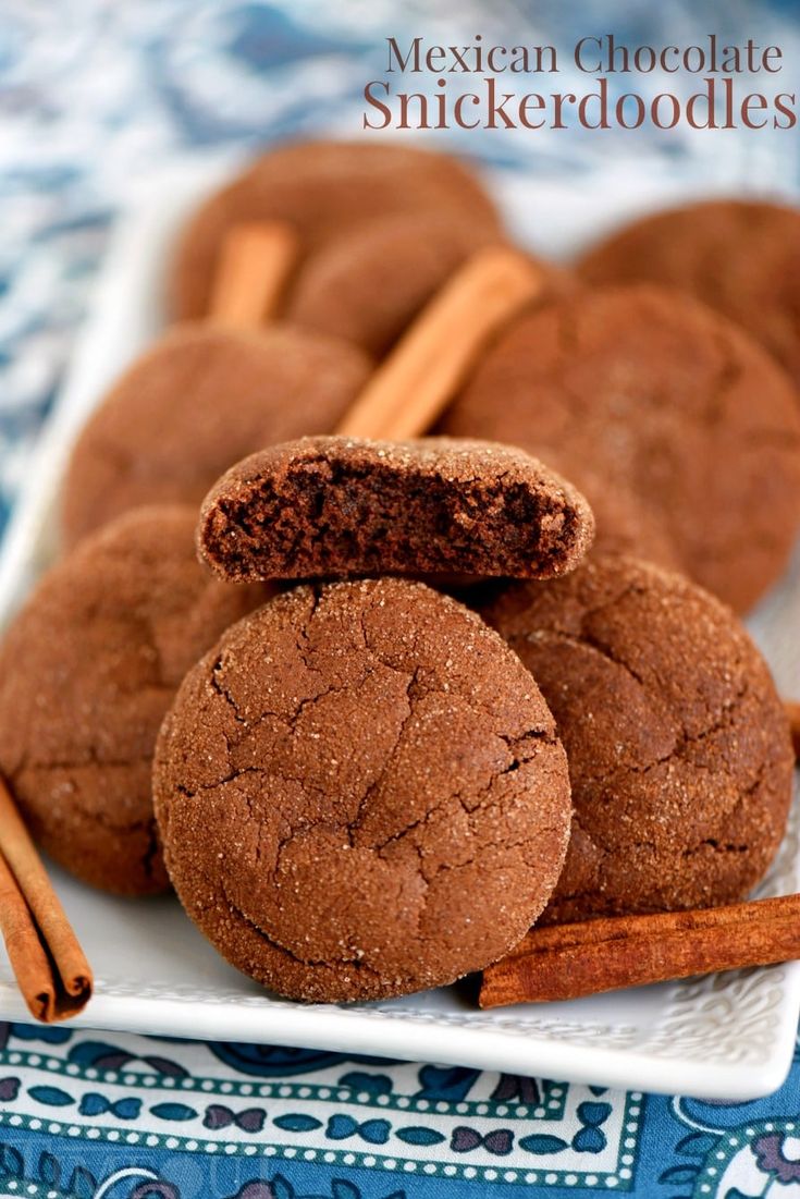 mexican chocolate spiced cookies on a plate with cinnamon sticks