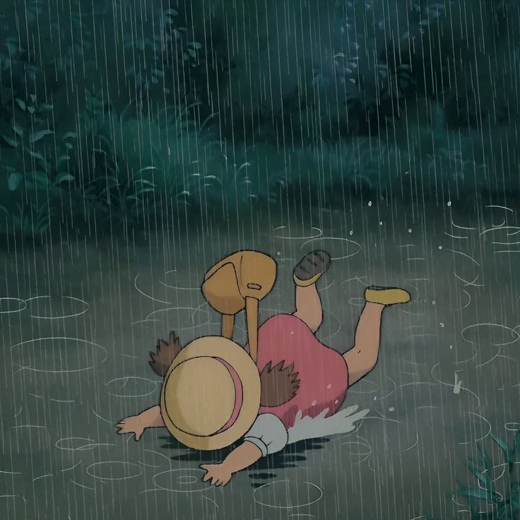 a cartoon character laying on the ground in the rain