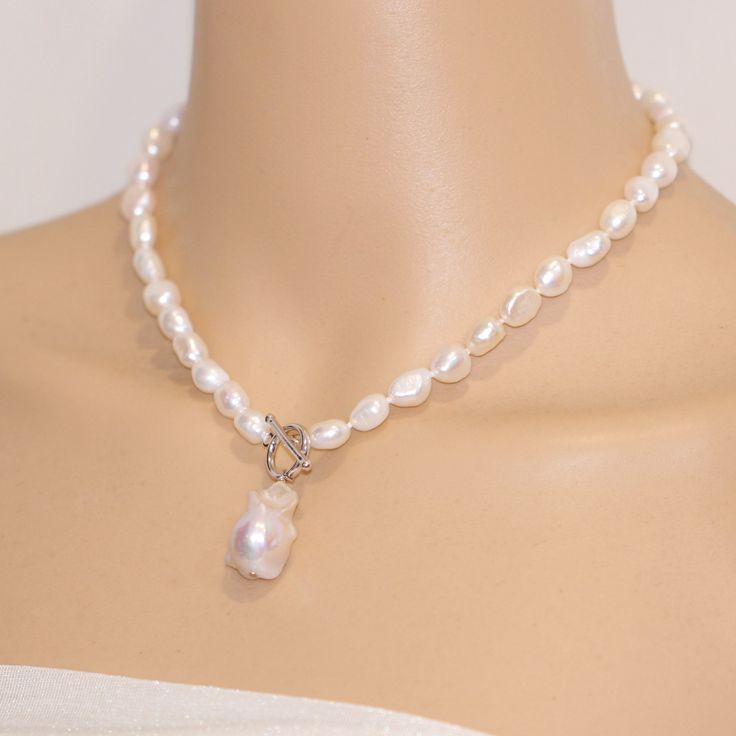 ON SALE The necklace is made of 8mm white color freshwater nugget pearls and 13-15mm white baroque pearl Item No: NK604 Material: freshwater pearls Shape:nugget shape and baroque pearl Size: 8mm and 13-15mm Color: white Luster: good Skin: with flaws Quality: AA clasp :silver 925 with white gold plated or yellow gold plated Hand Knotted: Yes Necklace length: any length can make, Packing: beautiful gift pouch,ready for gift giving Please contact Lisha freely if you have any specific demand or need Elegant White Toggle Necklace With Pearl Charm, Silver Toggle Necklace With Pearl Charm Gift, White Pearl Toggle Necklace With Pearl Pendant, White Baroque Pearl Lariat Necklace, White Pearl Toggle Necklace With Pearl Charm, Baroque Pearl Lariat Necklace With Pearl Charm, Silver Toggle Necklace With Pearl Pendant, Silver Toggle Necklace With Pearl Pendant As Gift, White Toggle Necklace With Pearl Chain