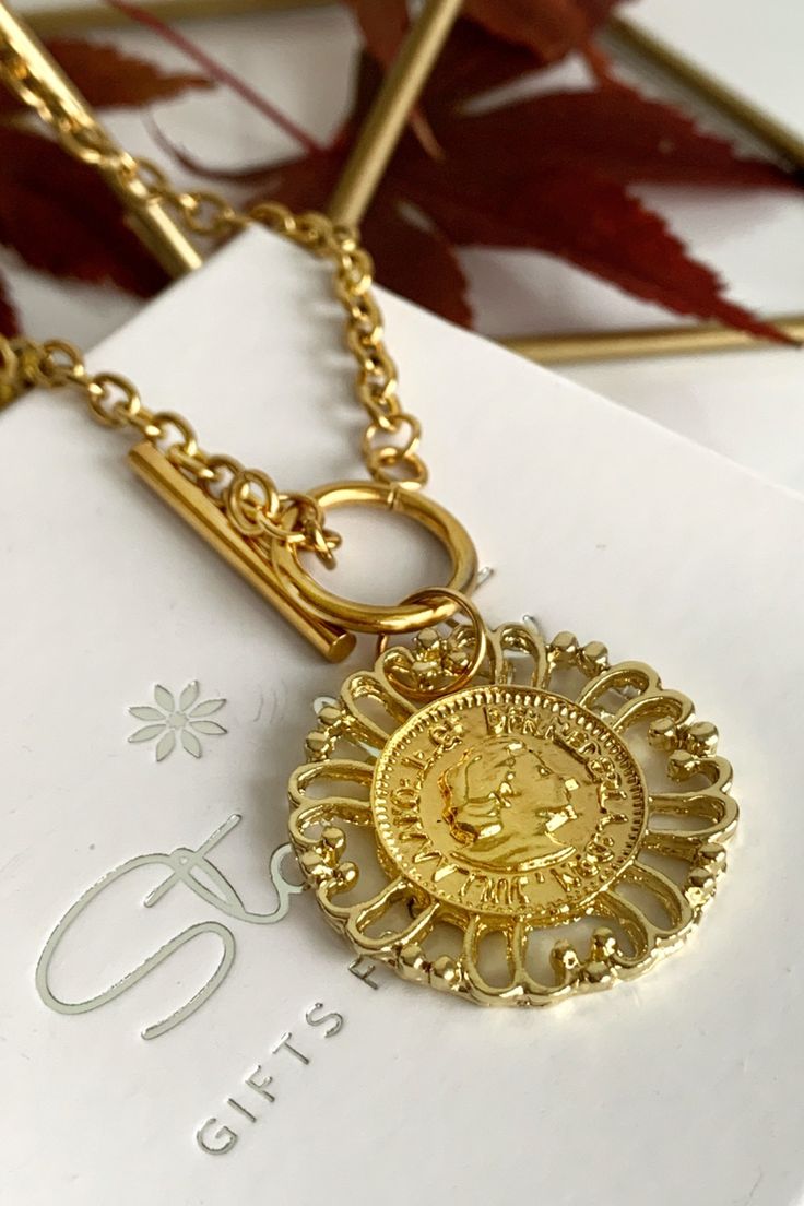 Gold Medallion Necklace With Lobster Clasp, Elegant Gold-tone Coin Necklace, Round Metal Medallion Necklace, Tarnish Resistant, Round Metal Medallion Necklace Tarnish Resistant, Vintage Brass Coin Necklace, Tarnish Resistant, Vintage Brass Medallion Necklace Tarnish Resistant, Antique Gold Coin Necklace Nickel Free, Vintage Brass Coin Necklace Tarnish Resistant, Gold Coin Necklace With Lobster Clasp As Gift