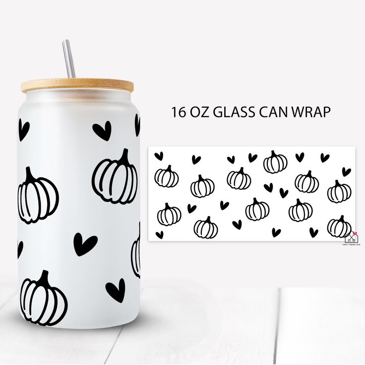 a glass jar with black and white pumpkins on it next to a sticker