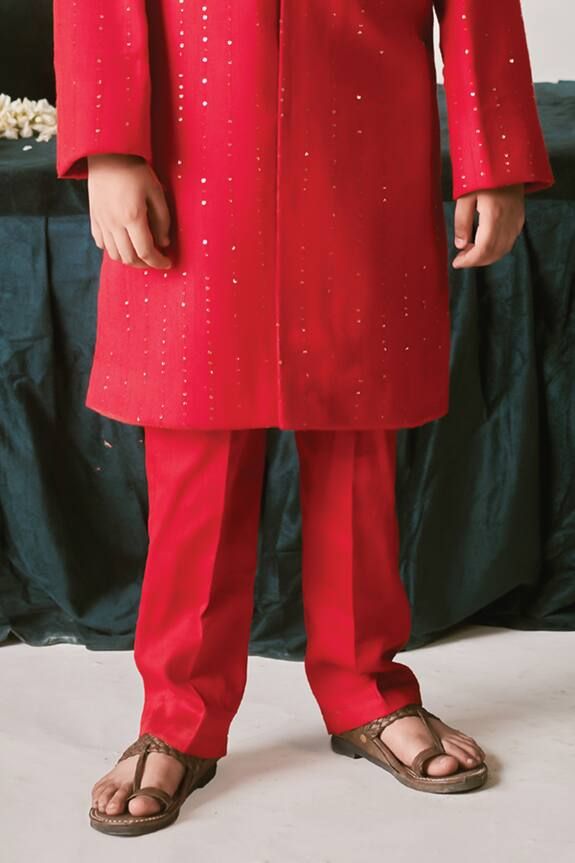 Crimson red sherwani with thread, sequin, cutdana, bead, crystal embroidery. Paired with kurta and pant. - Aza Fashions Ceremonial Red Sets With Dabka Detail, Traditional Party Sherwani With Gota Work, Party Wear Sherwani With Zari Work For Festivals, Ceremonial Red Sherwani With Dabka Work, Red Party Wear Sets For Eid, Red Party Wear Traditional Dress For Festive Occasions, Red Party Wear Traditional Outfit For Festive Occasions, Red Party Wear For Festive Occasions, Red Dori Work Sherwani For Festivals