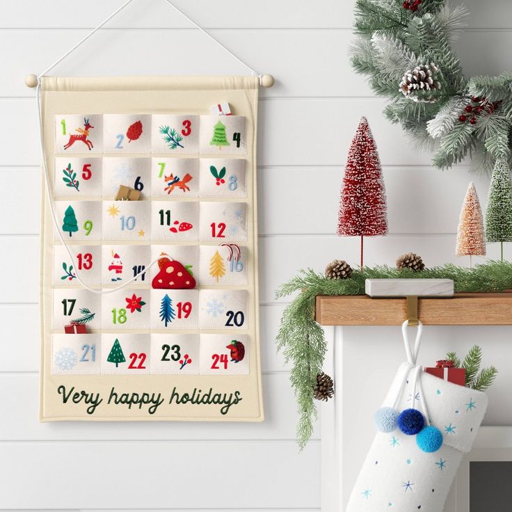 a christmas stocking hanging on the wall next to a calendar