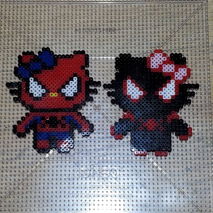 two pixellated images of red and black characters