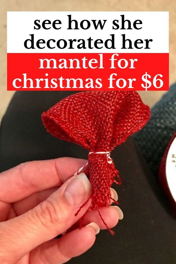 a woman is holding a red ribbon with the words, see how she decorated her mantel for christmas for $ 6