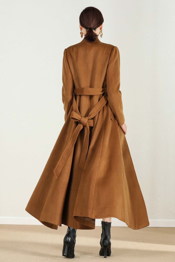 "This brown wool coat gives you the fall winter feels! Everything you need in a perfect midi wool coat is here. The wool coat to wear this season to work events, and out and about town....and now the search is over! It has been meticulously tailored with superior wool fabric that will keep you warm all season long. Every woman needs a wool coat in her wardrobe! DETAIL * Perfect Match with your favorite leggings, black slacks, denim jeans, etc * 50% wool blend, 50% fiber,nylon * Fully satiny lini Brown Single-breasted Wool Coat For Winter, Brown Long Sleeve Wool Coat For Fall, Long Brown Wool Outerwear, Brown Single Breasted Wool Coat For Spring, Single Breasted Brown Wool Coat For Spring, Brown Single-breasted Wool Coat For Spring, Solid Color Long Wool Coat For Fall, Brown Outerwear For Fall, Brown Solid Color Outerwear For Fall