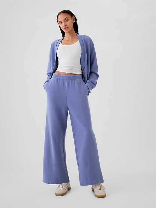 Textured Wide-Leg Ankle Sweatpants Fall Sweatpants For Elevated Casual Wear, Athleisure Pants For Elevated Casual Fall Wear, Fall Athleisure Pants For Elevated Casual Look, Soft Texture Loungewear Bottoms For Spring, Soft Texture Bottoms For Spring Loungewear, Relaxed Fit Sweatpants With Pockets For Daywear, Casual Solid Color Daywear Pants, Elevated Casual Solid Ankle-length Pants, Spring Sweatpants With Ribbed Cuffs And Tapered Leg