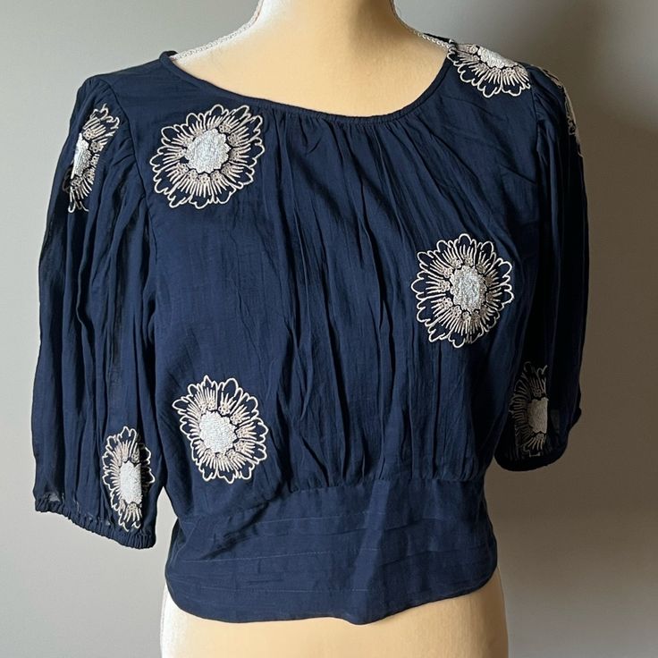 Free People Navy Blue 3/4 Sleeve Flower Embroidered Blouse Skirt And Necklace Sold Separately! Spring Floral Embroidered Half Sleeve Top, Blue 3/4 Sleeve Tops With Floral Embroidery, Fitted Embroidered Floral Top With Short Sleeves, Fitted Embroidered Top With Floral Print And Short Sleeves, Summer Blouse With Floral Embroidery And 3/4 Sleeve, Blue Floral Embroidery Blouse With 3/4 Sleeves, Fitted Floral Print Embroidered Top With Short Sleeves, Blue Blouse With Floral Embroidery And 3/4 Sleeves, Blue Fitted Embroidered Short Sleeve Top