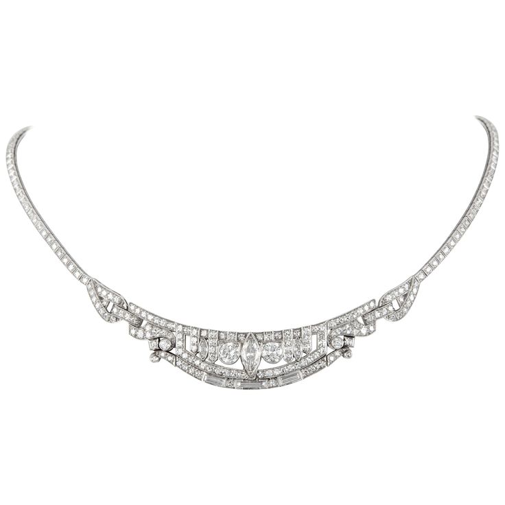 Stunning vintage Art Deco style diamond high jewelry necklace, centered with a marques diamonds. Approximately 10.80 carats of round, marquess, and baguette diamonds. Approximately G/H color and VS clarity. Platinum. Accommodated with an up-to-date appraisal by a GIA G.G. once purchased, upon request. Please contact us with any questions. Item Number N6429 Diamond High Jewelry, High Jewelry Necklace, Vintage Diamond Necklace, Black Gold Necklace, Art Deco Pendant Necklace, Art Deco Jewelry Vintage, Diamond Drop Necklace, Opal Pendant Necklace, Art Deco Pendant