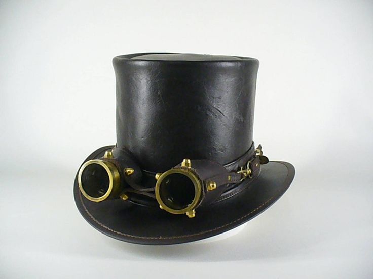 BROWN  LEATHERS STEAMPUNK TOP HAT WITH AVIATOR GOGGLES All our products are hand made by John Whittaker (leather craftsman since 1972) in our workshop in Hurstbridge, VIC, Australia. Please visit our Ebay store for more of our hats & Accessories Our  brown leather Steampunk Top Hat: Made using top quality cowhide leather Comes with the golden aviator goggles, set in a hand made leather casing with the bolts & clips as in the photo The brim is re-enforced with a strong, yet lightweight wire, to m Vintage Hat For Cosplay, Vintage Hat Costume Accessories For Cosplay, Vintage Fitted Top Hat For Cosplay, Steampunk Costume Accessories With Brimmed Shape, Vintage High Crown Costume Hats For Themed Events, Vintage High Crown Accessories For Costume Party, Vintage High Crown Costume Accessories For Costume Party, Vintage Fitted Costume Accessories For Cosplay, Fitted Vintage Costume Accessories For Cosplay