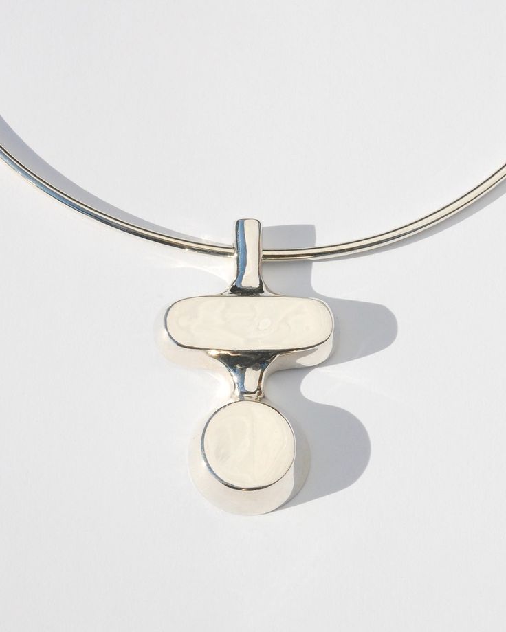 This striking modernist collar features a bold pendant of stacked forms on a clean sterling silver collar. Available in solid brass or sterling silver on an 18" sterling silver collar. Collar closes with a button clasp. Availablility: Currently in stock and ready to ship. Clean Sterling Silver, Traditional Crafts, Jewelry Inspo, Modern Classic, Custom Jewelry, Chains Necklace, Solid Brass, Monument, Jewelry Making