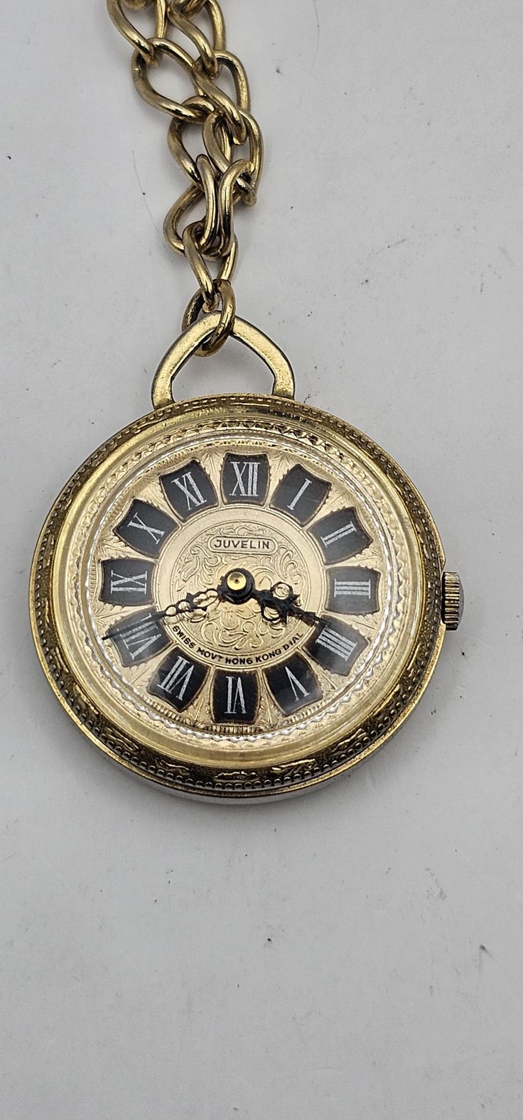 A Vintage Juvelin Roman Numeral Pocket Watch with Chain Swiss Hong Kong, Gold tone, Running, serviced, Gift for him/her Brand: Juvelin Swiss HonG Kong, functions : Hours, minutes Case size : 36 mm diameter without crown Case thickness : 11.2 mm Movement : Manual wind 1 jewel Swiss made movement, running and keeps time condition: good cosmetic condition, It is in generally good shape. As a used vintage item, it may have some dirt, scratches, and other signs of wear (Please see various photos). Weird Watch, Pocket Watch With Chain, Roman Numeral, Roman Numerals, Swiss Made, Gift For Him, Pocket Watch, Etsy Store, Hong Kong