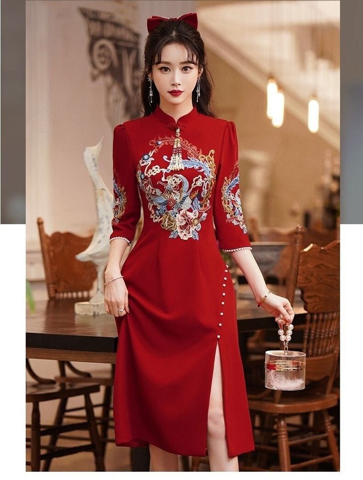 "⭐⭐ This Dress is stunning for Brides who wants to have a traditional Chinese Wedding celebration. Vivid Wine Red with Classical Chinese Embroidery Flowers Art and Tassels 囍, Stands for Joy and Happiness for the bride and groom. ⭐ Size Chart by Centimetre/ CM: Bust / Waist XS : 77CM/ 63CM; S: 83CM/ 66CM ; M : 86CM/ 70 CM; L: 90 CM/73 CM; XL: 93CM/ 76 CM; XXL: 96CM/ 80CM; 3XL: 99CM/ 83CM; Or Custom Size Available. ⭐ Three Dress Length Option: To Knee( About 100cm) To Mid-Calf (about 120cm); Full Red Gown With Intricate Embroidery For Ceremonial Events, Traditional Ao Dai With Floral Embroidery For Ceremony, Traditional Long Sleeve Gown For Banquet, Elegant Fitted Embroidered Dress For Traditional Ceremonies, Formal Long Red Cheongsam, Formal Red Gown With Floral Embroidery, Elegant Red Gown With Floral Embroidery, Ceremonial Dresses With Floral Embroidery, Traditional Embroidered Cheongsam For Wedding