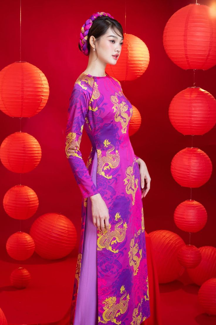 Indulge in elegance with our Ao Dai. This stunning piece features a sheath silhouette and long sleeves, crafted from luxurious brocade fabric. Perfect for any formal occasion, it will make you stand out in a sea of ordinary. Elevate your style with Coco. Ceremonial Long Sleeve Ao Dai, Fitted Long Sleeve Ao Dai For Ceremony, Elegant Fitted Purple Ao Dai, Festive Long Sleeve Ao Dai For Ceremony, Festive Formal Fitted Ao Dai, Festive Pink Ao Dai For Formal Occasions, Traditional Long Sleeve Ao Dai For Formal Occasions, Festive Fitted Ao Dai For Ceremony, Elegant Silk Ao Dai For Party