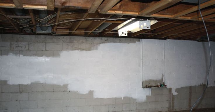 an unfinished room with exposed electrical wires on the wall