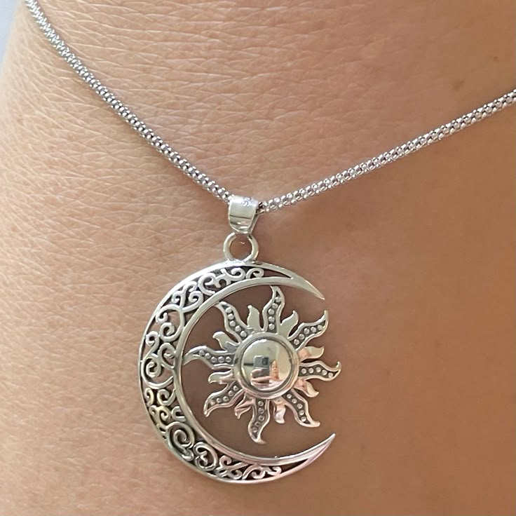 *  Sterling Silver Large Filigree Blazing Sun and Moon Pendant with Italian Necklace, Sun and moon Necklace, promise Sun Pendant, Celestial Pendant, Love Necklace, Silver Sun Necklace, Large Moon Pendant. 925 Stamped. *  The sun symbolizes firmness, strength and power while the moon represents calmness, beauty, nurturing.  *  Perfect gift idea for any occasion: birthday, anniversary, engagement, graduation, bridesmaid, Mother's Day, Valentine's Day, Christmas, promise. *  Your purchase includes a gift box come. Let us know if this is a gift and we can ship directly to the recipient and include a personalized note. *  We greatly appreciate your order with us.  *  Note: Due to the difference between different phone or monitors the pictures may not reflect the actual color of the Ring. **CHAI Silver Moon Necklace With Sun And Moon Design, Silver Moon Charm Necklace With Sun And Moon Design, Silver Half Moon Necklace With Sun And Moon Design, Silver Jewelry With Sun And Moon Design, Bohemian Half Moon Adjustable Jewelry, Adjustable Bohemian Half Moon Jewelry, Silver Moon Charm Jewelry In Alloy, Adjustable Crescent Necklace With Sun And Moon Design, Alloy Jewelry With Moon Charm As Gift