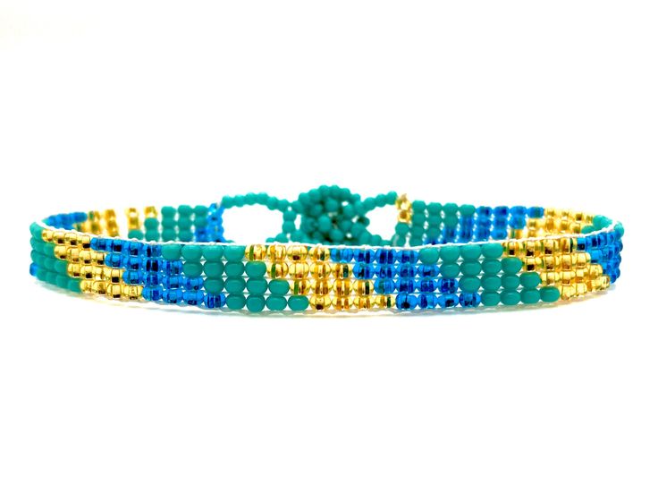 "Perfect for a pop of color! This turquoise \"skinny\" bracelet will charm your way through the day. Made using brilliant glass seed beads and premium nylon, these bohemian styled bracelets are dressed to impress and are a must-have every day accessory! Makes for a great birthday gift, Christmas gift, holiday gift, stocking stuffer, friendship bracelet and especially a \"just because\" gift for mom! Delicately handmade in Guatemala *Please note that all of our items are handcrafted and unique to Bohemian Blue Friendship Bracelets For Summer, Adjustable Turquoise Wrap Bracelet For Festival, Blue Bohemian Friendship Bracelets For Summer, Bohemian Turquoise Bracelets For Summer, Turquoise Friendship Bracelets For Summer Festival, Blue Beaded Bracelets For Summer Festival, Turquoise Bohemian Beaded Bracelets For Summer, Bohemian Turquoise Braided Bracelets With Round Beads, Bohemian Braided Bracelets With Turquoise Round Beads