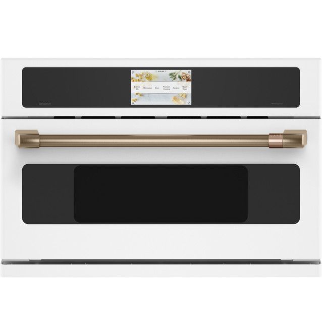 a white oven with gold trimmings and an appliance on the front