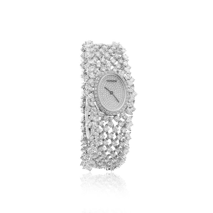 YEPREM watch adorned with a combination of round and marquise diamonds boasting exceptional clarity of VVS and VS, as well as a striking F-G color. Round Diamond: 12.92 ct Marquise Diamond: 9.14 ct Stone Quantity: 487 Total Weight: 83.49 g The size can be adjusted for the perfect fit. Kindly contact us to meet your in Luxury Round Diamond Watch For Weddings, Designer Diamond Watch With Round Dial For Evening, Luxury Silver Watches With Single Cut Diamonds, Modern Diamond Watch For Evening, Luxury Jewelry And Watches With Round Dial For Wedding, Luxury Wedding Jewelry And Watches With Round Dial, Diamond Wedding Watch With Subdials, Designer Diamond Watch With Diamond Hour Markers For Evening, Luxury Diamond White Jewelry And Watches For Wedding