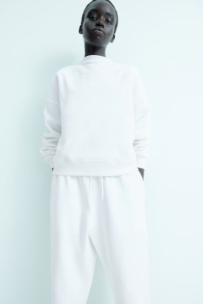 Sweatshirt - White - Ladies | H&M US Boxy Fit Crew Neck Sweatshirt For Spring, Spring Hoodie With Drop Shoulder And Ribbed Cuffs, White Ribbed Collar Sweatshirt For Spring, Basic Spring Sweatshirt With Ribbed Cuffs, White Sweatshirt With Ribbed Collar For Loungewear, White Ribbed Collar Sweatshirt For Loungewear, Solid Color Sweatshirt With Ribbed Cuffs And Funnel Neck, Solid Sweatshirt With Ribbed Cuffs And Funnel Neck, Casual Sweater With Ribbed Cuffs And Boxy Fit