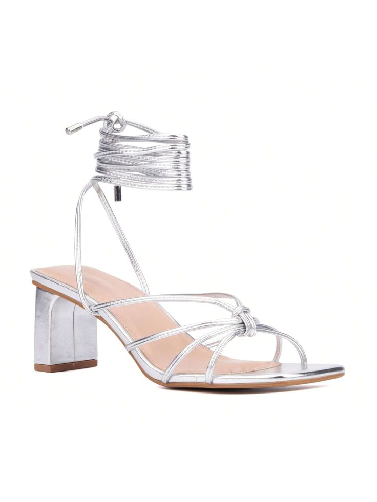 These exotic strappy heeled sandals are a go-to for many in the fashion crowd. The multi-wrap ankle strap and stacked kitten heel finish the style.• Upper: 100% Faux Leather• Outsole: 100% Rubber• Lining: 100% Faux Leather• Heel Height: 2.38"Fashion To Figure Women's Lana Strappy Heel Sandal - WIDE WIDTH Metallic Silver         Wide Fit Shoes, size features are:Bust: ,Length: ,Sleeve Length: Adjustable 4-inch Heel Summer Sandals, Summer Strappy Lace-up Sandals With Heel Loop, Adjustable Sandals With 4-inch Heel For Spring, Trendy Summer Lace-up Sandals With Stacked Heel, Summer Trendy Lace-up Sandals With Stacked Heel, Trendy Strappy Heels With Wrapped Heel, Spring Sandals With Wrapped Heel And Adjustable Fit, Silver Strappy Sandals For Spring, Spring Silver Strappy Sandals