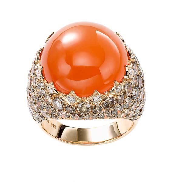 18k Yellow Gold Center Stone: Orange Cabochon Moonstone, 17.61ct Diamonds: Round Brilliant Champagne, 5.76tcw This is a one-of-a kind ring, currently available. Luxury Oval Cabochon Gemstones, Elegant Domed Moonstone Gemstone Ring, Luxury Multi-stone Moonstone Ring, Luxury Multi-stone Round Moonstone Ring, Luxury Wedding Moonstone Ring Cabochon, Luxury Polished Moonstone Ring With Oval Cabochon, Luxury Polished Oval Cabochon Moonstone Ring, Luxury Oval Cabochon Moonstone Ring With Polished Finish, Luxury Oval Moonstone Ring For Anniversary