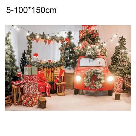 a red car with presents on the roof and christmas trees around it in front of a white wall