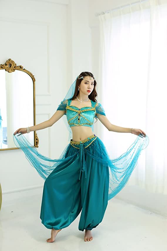 a woman in a blue belly dance costume