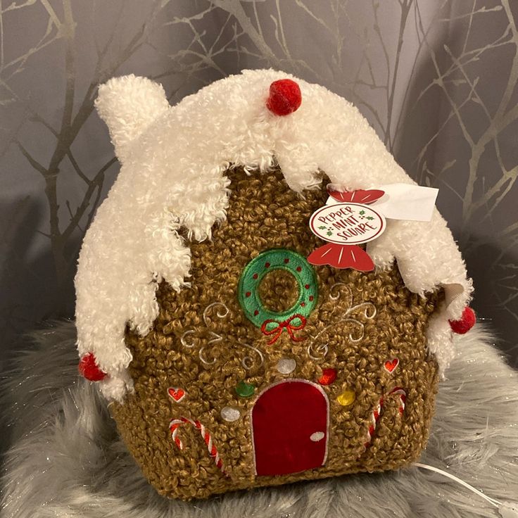 a house made out of rice krispy kreme and frosted with candy canes