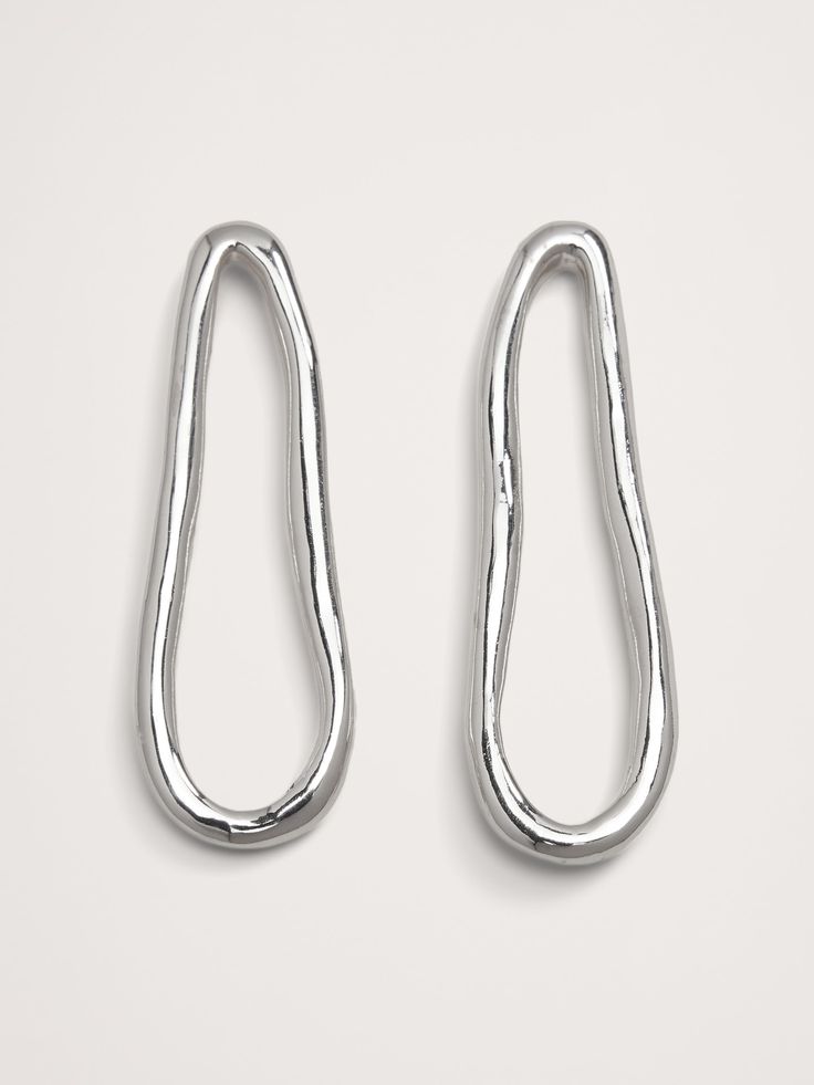 Long post earrings are sinuously shaped in highly polished silver-plated brass.  Silver-plated brass.  Stainless steel post backs.  Made in India.  Length: 2. 3" Steel Post, Long Earrings, Post Earrings, Banana Republic, Silver Plate, Women's Accessories, Silver Plated, Plating, Brass