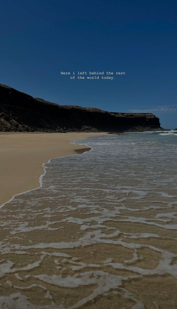 there is a beach with waves coming in to the shore and an inspirational quote above it