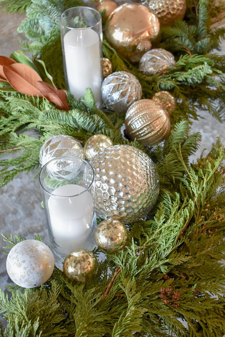 candles and ornaments are arranged on a table