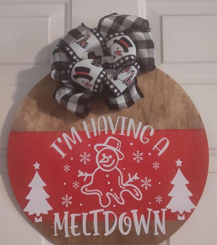 a wooden sign that says i'm having a meltdown with a snowman on it