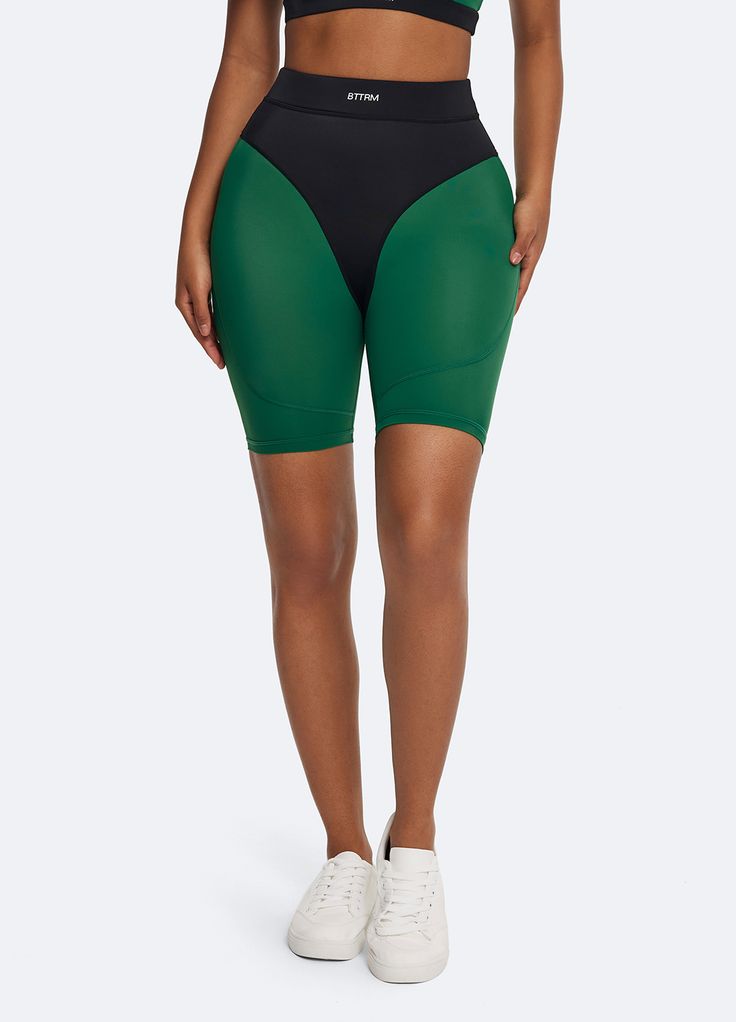 Sporty Nylon Yoga Bottoms, Sporty Nylon Bottoms For Yoga, Squat Proof Nylon Bottoms For Yoga, Squat Proof Nylon Yoga Bottoms, Sporty Yoga Bottoms With Built-in Padding, Versatile High Stretch Athletic Shorts For Sports, High Stretch Nylon Bottoms For Athleisure, Compression Bottoms With Built-in Shorts For Training, Versatile High-stretch Athletic Shorts For Sports