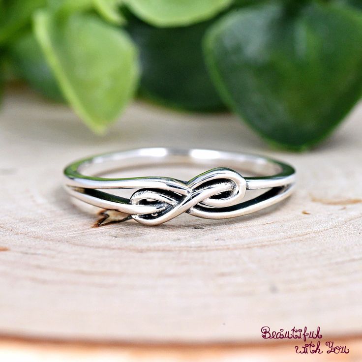 Minimalist Infinity Knot Promise Ring, Women's Statement Ring, Solid 925 Sterling Silver Infinity Ring, Gift for Her, Women's Silver Ring Metal Material: 925 Sterling Silver (Not Plated or Filled) Metal Stamp: 925 (Stamped for Authenticity) Finish: Rhodium Plated for Tarnish Resistance to Maintain its Original Shine. Band Width: 4mm - Our Sterling Silver Rings Exhibit an Elegant and Luxurious Look at an Affordable Price.  - Rhodium Plated for Tarnish Resistance to Maintain its Original Shine. It Adjustable Infinity Ring For Mother's Day, Mother's Day Infinity Adjustable Rings, Sterling Silver Stackable Infinity Jewelry, Sterling Silver Infinity Stackable Rings As Gift, Gift Sterling Silver Infinity Stackable Rings, Sterling Silver Infinity Stackable Rings, Sterling Silver Infinity Ring Gift, Sterling Silver Infinity Ring, Adjustable Infinity Stackable Rings For Anniversary