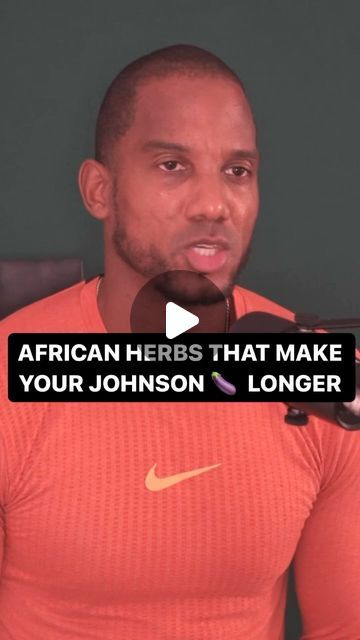 a man in an orange shirt talking into a microphone with the words african herbs that make your johnson longer