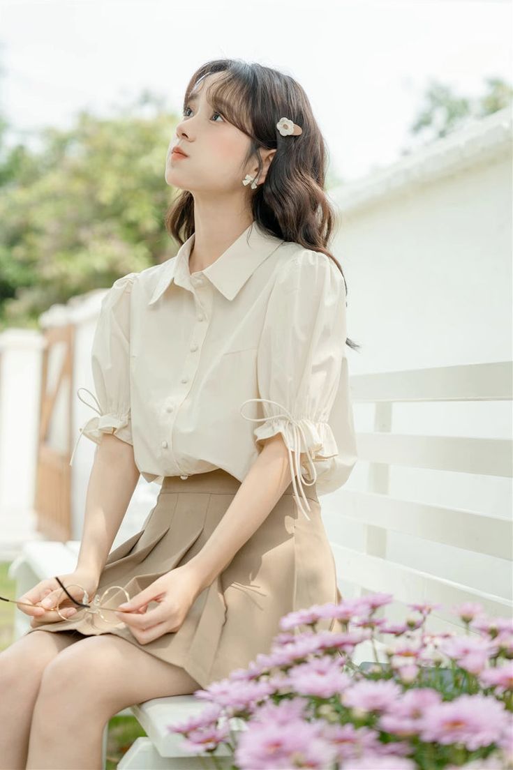 Basic but cute button up shirt with a classic collar, rounded buttons and short puff sleeves with ribbon-tied frilly cuffs. S: 14" across shoulders, 40" chest, 23.5" lengthM: 14.5" across shoulders, 41.5" chest, 23.5" lengthL: 15" across shoulders, 43" chest, 24" length Casual Blouse With Puff Tie Sleeves, Summer Solid Blouse With Cuffed Sleeves, Summer Office Blouse With Tie Sleeves, Spring Button-up Blouse With Tie Sleeves, Summer Solid Color Blouse With Cuffed Sleeves, Solid Color Summer Blouse With Cuffed Sleeves, Spring Office Lady Blouse With Puff Sleeves, Spring Office Lady Puff Sleeve Blouse, Spring Puff Sleeve Blouse For Office