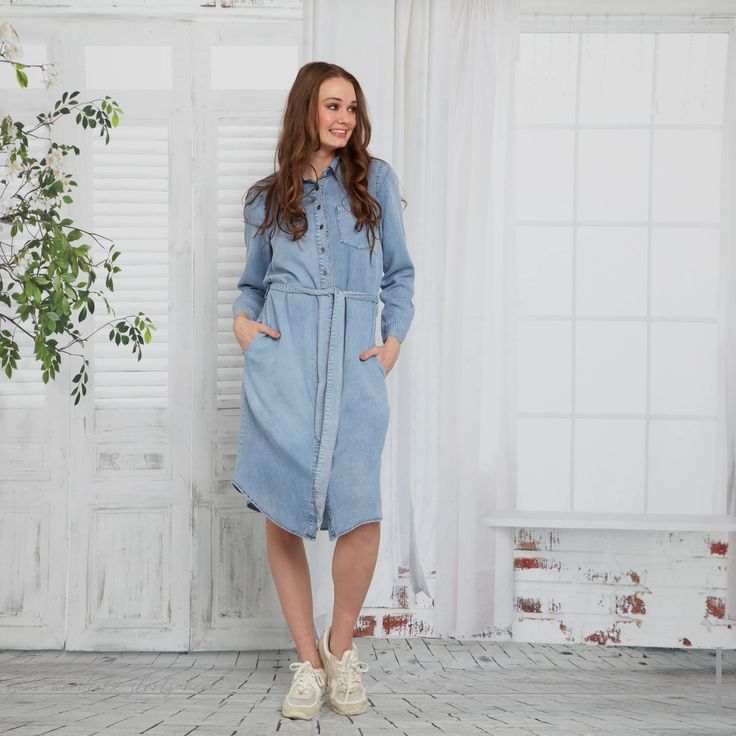 Experience effortless style with this denim dress. This button down summer dress is crafted from high-quality denim, offering comfort and durability. Perfect for any occasion, this dress is a must-have addition to your wardrobe. Elevate your look and feel confident in this versatile and chic piece! Medium Wash Button-up Dress For Daywear, Denim Blue Cotton Button-up Dress, Button-up Denim Blue Cotton Dress, Washed Blue Denim Dress With Pockets For Day Out, Relaxed Fit Chambray Denim Dress In Medium Wash, Relaxed Fit Chambray Denim Dress, Light Wash Chambray Denim Dress, Casual Mid-length Denim Dress, Light Wash Chambray Denim Dress For Day Out