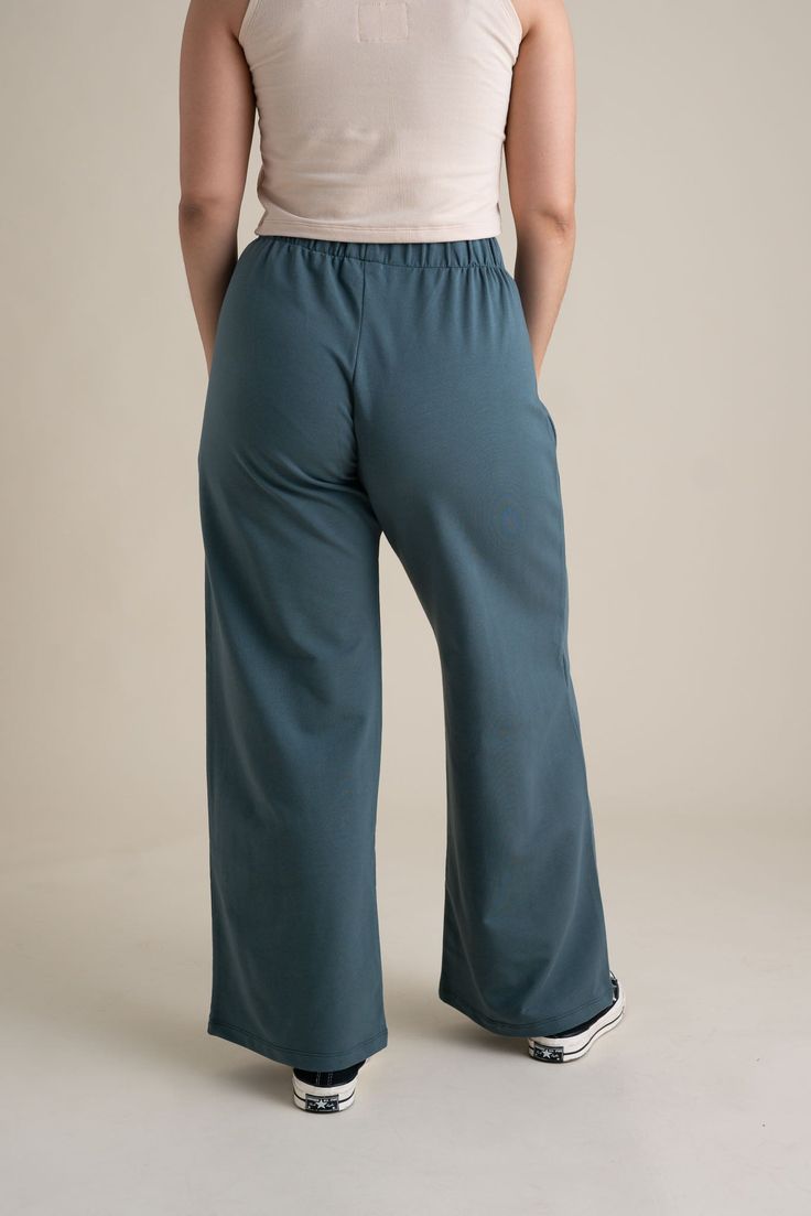 The Greta Pant (FKA The Lounge Pants) are wide-leg wonders! Ideal for couch hangs, going on walks, or doing yoga. They feature an easy and comfortable elastic waistband. Our French Terry is soft, super stretchy and made from organic cotton! You can freely move or lounge in long-lasting 95% organic cotton and 5% spandex. Feel completely at ease in soft earth tones, 4-way stretch, and fabric that is flattering for all bodies. Stretch Moisture-wicking Yoga Pants In Recycled Polyester, Elastic Full-length Lounge Pants, Compressive Moisture-wicking Yoga Pants In Recycled Polyester, Wide-leg Capris With Elastic Waistband For Loungewear, Going On Walks, Comfortable Wide-leg Sleepwear With Elastic Waistband, Soft Earth Tones, The Lounge, Olive Color