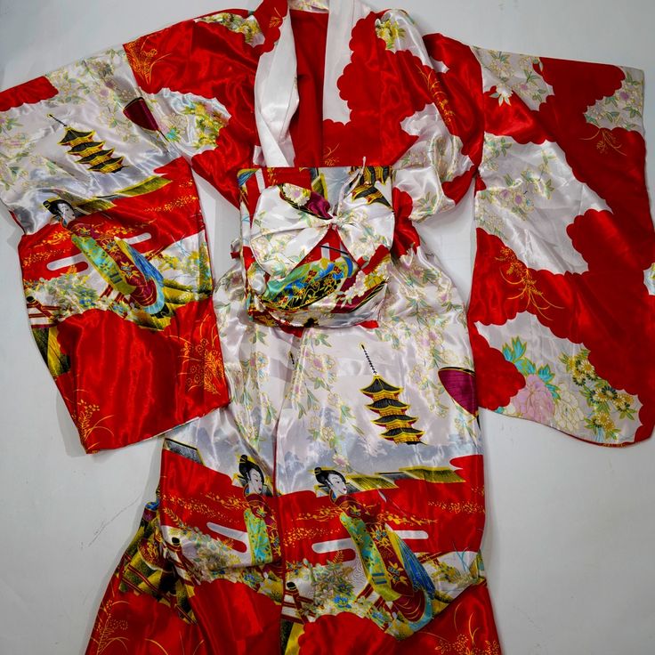 Beautiful Kimono Silk Style Jacket Floral Design Never Worn Belted Kimono Measurements: Arm: 21’ Length: 51.5’ Width: 30’ Osfm Fits Sizes 2-18 Material: Viscose/Polyester Fitted Red Bohemian Kimono, Red Vintage Kimono For Spring, Red Long Sleeve Kimono For Spring, Red Kimono Sleeve Outerwear For Spring, Red Outerwear With Kimono Sleeves For Spring, Fitted Red Kimono For Spring, Fitted Red Long Sleeve Kimono, Red Kimono With Kimono Sleeves For Winter, Red Winter Kimono With Kimono Sleeves