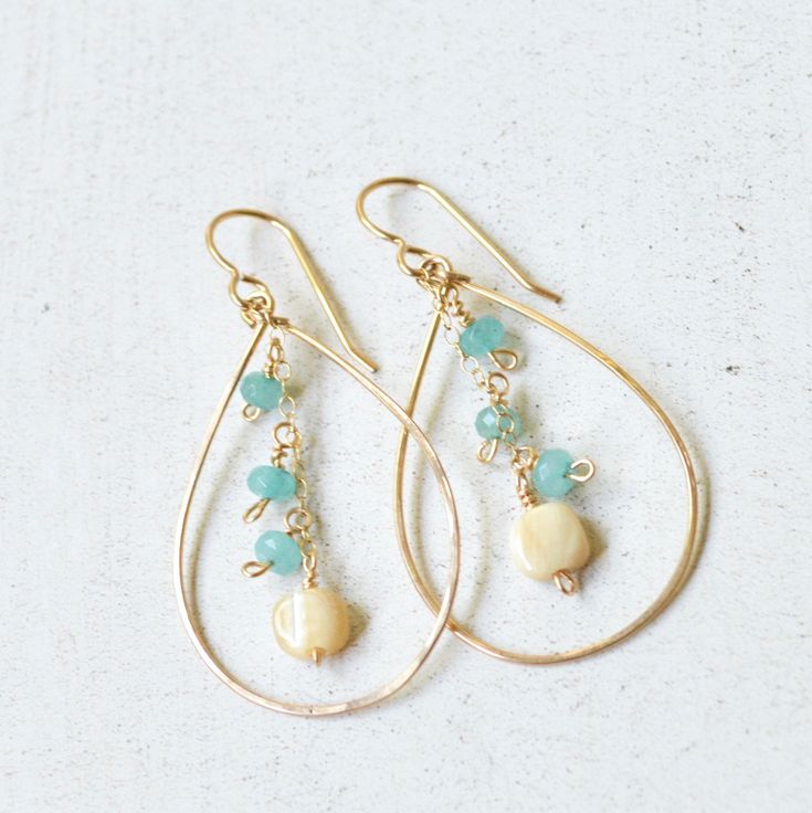 "These lovely gold teardrop earrings feature tiny aqua dyed jade and mother of pearl daintily hanging from a gold filled chain. Teardrops are made from hammered 18g gold filled wire & measure approximately 2\" in length." Everyday Teardrop Jewelry With Dangling Beads, Gold Dangle Teardrop Earrings For Everyday, Dainty Gold Teardrop Earrings With Pearl Drop, Dainty 14k Gold Filled Teardrop Earrings, Everyday Teardrop Earrings With Dangling Beads, Handmade Gold Teardrop Earrings In 14k Gold Filled, Handmade 14k Gold Filled Teardrop Earrings, Dainty Teardrop Earrings With 14k Gold Filled, Dainty Gold Teardrop Dangle Earrings