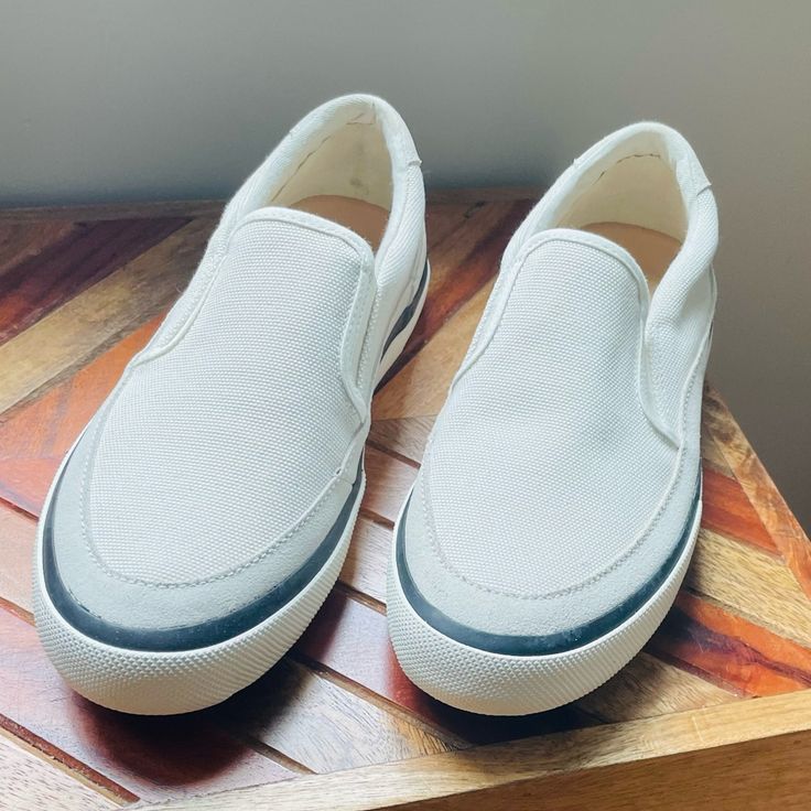 Nwot Clarks Slip-Ons. White Canvas Slip-ons For Summer, White Slip-on Sneakers For Everyday, Beige Slip-on Sneakers For Everyday, Casual White Slip-ons With Contrast Sole, Casual White Slip-ons With Textured Sole, Everyday White Canvas Sneakers, White Casual Flat Canvas Shoes, Classic White Flat Slip-ons, White Canvas Slip-ons With Cushioned Footbed