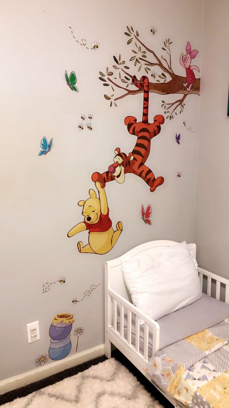 winnie the pooh and tigger wall decals in a child's bedroom