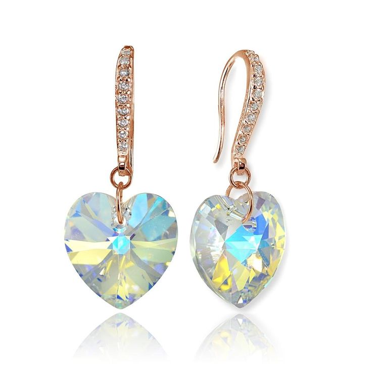 These stunning earrings for women and teen girls feature heart shaped designs created with Swarovski crystals in a gorgeous Aurora Borealis color, a must-have for any jewelry collection. These beautiful earrings are secured with fishhooks that are encrusted with round cubic zirconia stones, for an extra dazzle. The earrings are crafted of fine rose gold flashed sterling silver, and are nickel free. Product Details Metal Type rose-gold-flashed-silver Metal Stamp 925-sterling Weight 3.9GR Length 3 Crystal Heart Drop Earrings For Anniversary, Crystal Heart-shaped Earrings For Pierced Ears, Heart Cut Crystal Earrings, Heart-shaped Crystal Earrings For Anniversary, Crystal Heart Earrings, Turquoise Heart, Heart Dangle Earrings, Heart Drop Earrings, Leverback Earrings