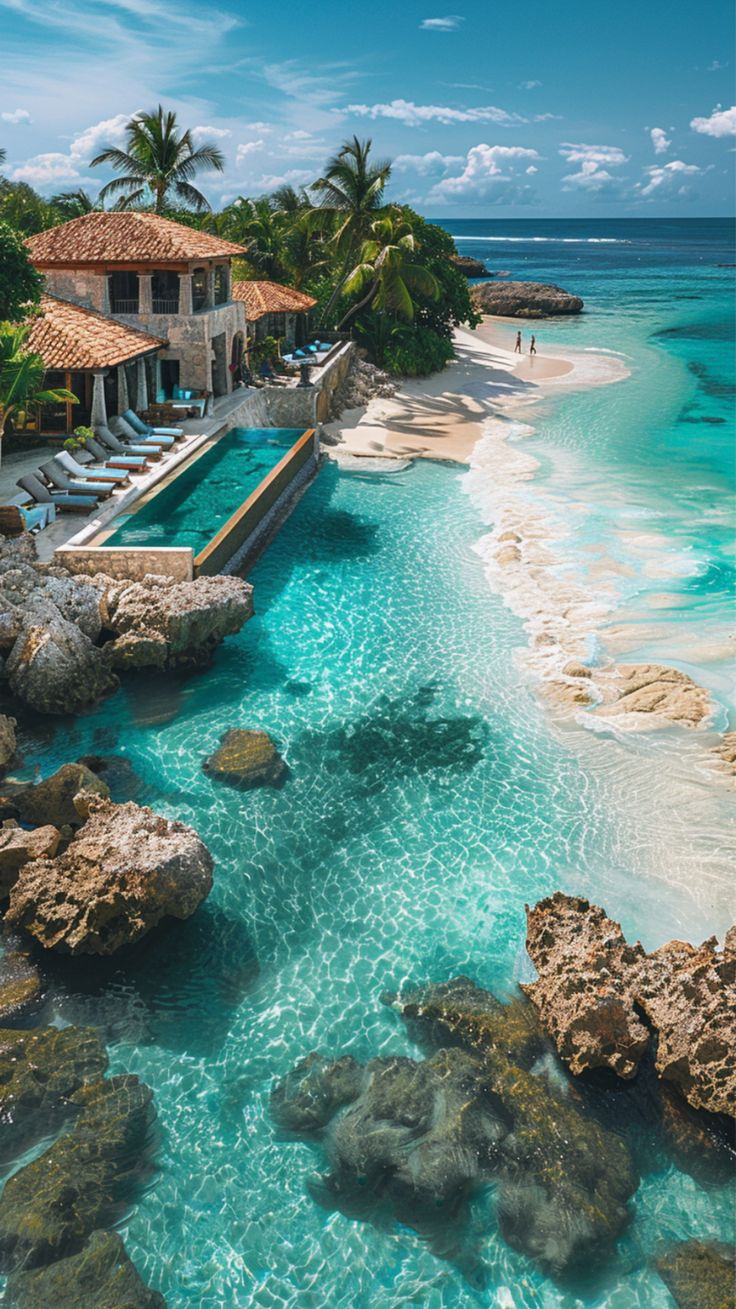 an aerial view of the beach and pool at sandals resort in cancucilla, mexico