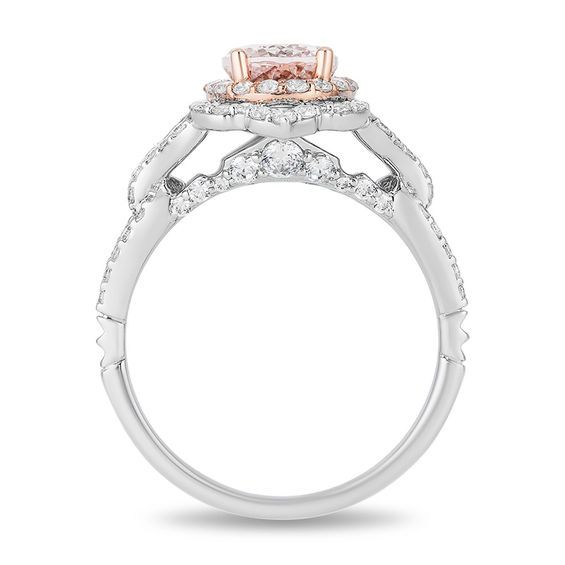 an engagement ring with two tone gold and white diamonds on the sides, set in 18k