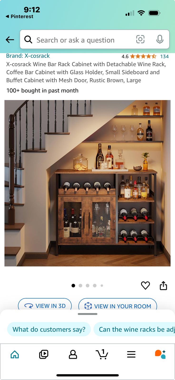 an image of a room with stairs and wine bottles on the shelves in front of it