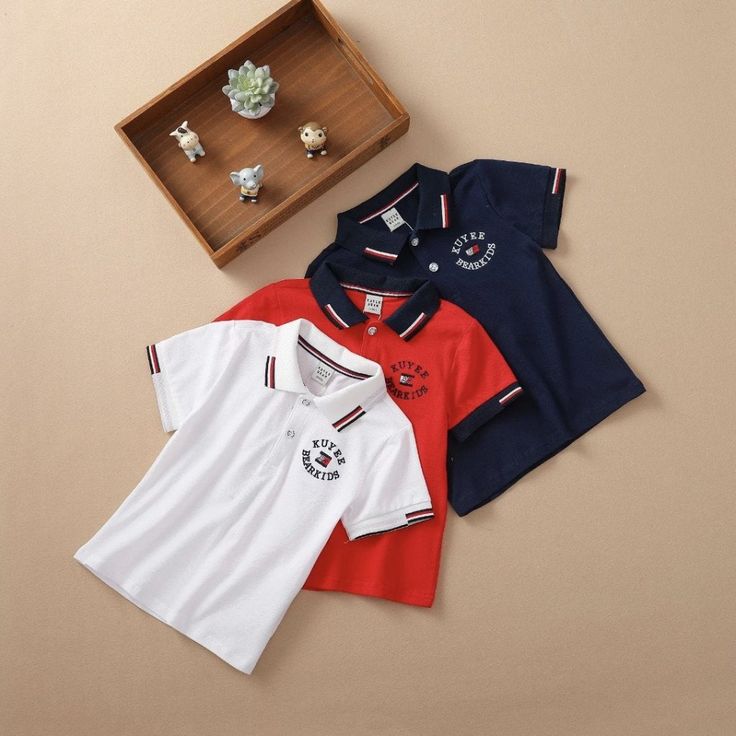 This Short-Sleeve Polo Shirt Is Stylish For Boys. It Is The Ideal Shirt For Summer, Fall, And Spring. It Is Made Of High-Quality Material. It Comes With A Neck Collar And Buttons In The Front. Size: 5 Years, 6 Years Materials: 100% Cotton Color: Red (5 Years), White (6 Years) Available Closure: Buttons Sleeve: Short Sleeve Gender: Boys Collared Cotton Tops With Letter Print, Collared Cotton Tops For School, Summer Cotton Polo Shirt For School, Collared Tops For School, Casual Cotton Polo Shirt For School, Red Collared Top For School, Collared Cotton T-shirt For School, Red Short Sleeve Tops For School, Summer School Cotton Polo Shirt