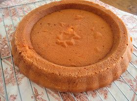 a cake sitting on top of a cooling rack