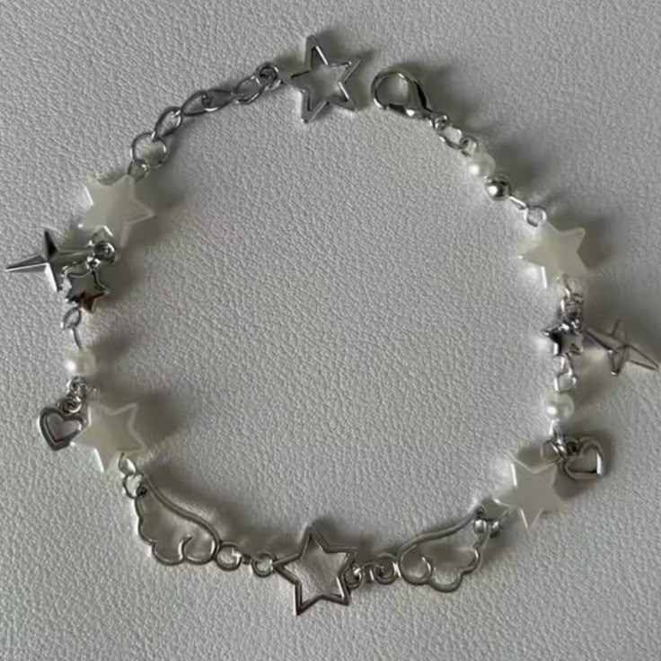 Chrome Winged Star Acubi Beaded Charm Bracelet Cute Y2k Bracelets, Button Charm Bracelet, Letter Beaded Bracelets, Bracelet With Small Beads, Silver Wrist Stack, Casual Star Charm Jewelry, Casual Star-shaped Jewelry For Parties, White Star-shaped Metal Jewelry, White Metal Beaded Bracelets For Party